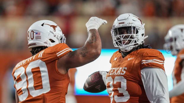 Texas Longhorns DT Byron Murphy celebrates with T'Vondre Sweat